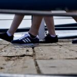 feet on a boardwalk